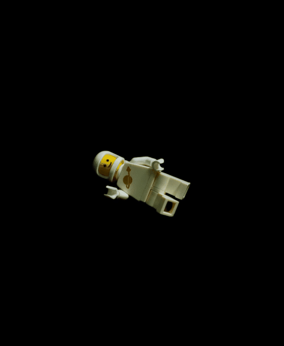 Astronaut minifigure floating in darkness
